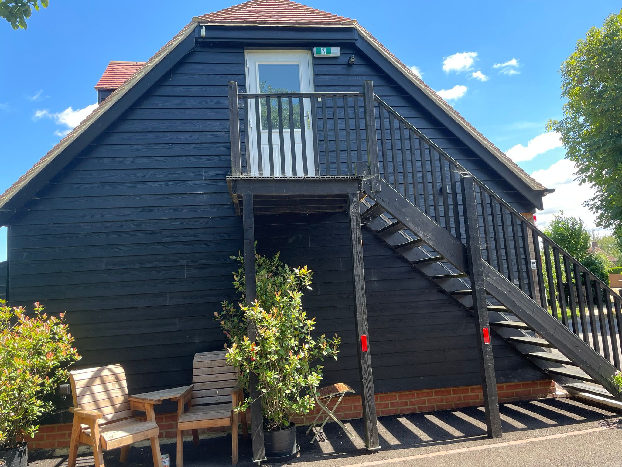 Rear of the Den with balcony and garden